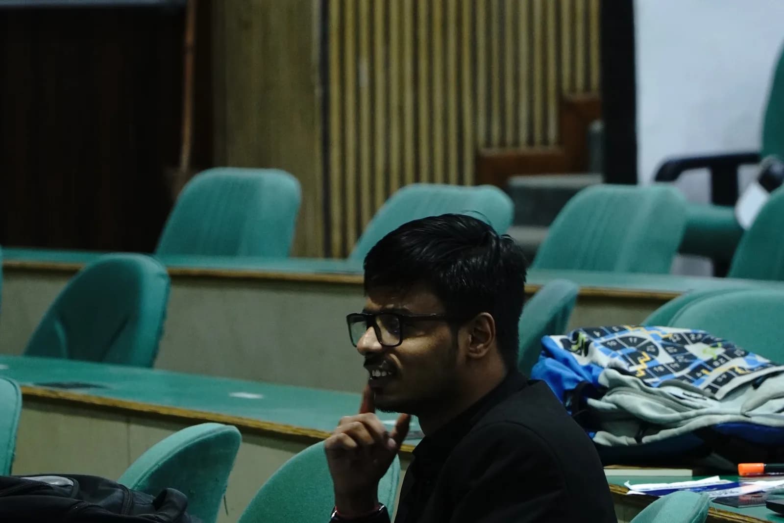 A delegate thinking through a draft resolution in the committee hall